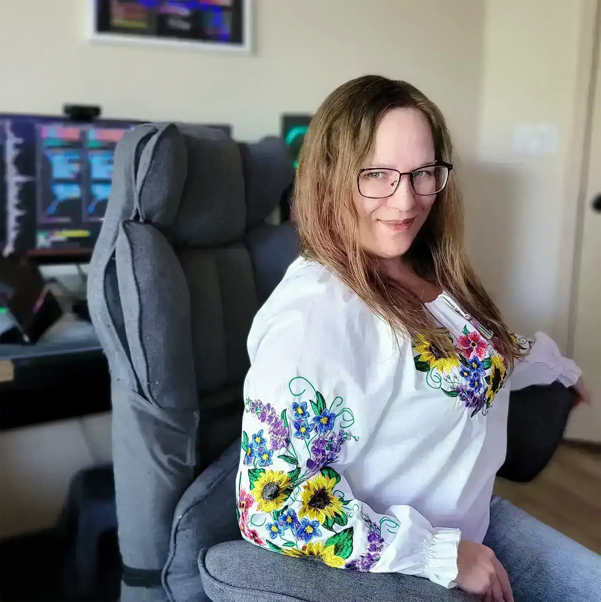 Alisa Podhaina sitting at her desk